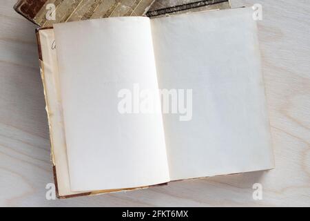 Old vintage book on wooden table. Open book with blank pages Stock Photo