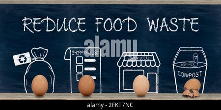 Reduce food waste text, ways to reduced food waste using eggs, sustainable living and zero waste Stock Photo