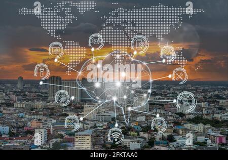 Polygonal brain shape of an artificial intelligence with various icon of smart city Internet of Things Technology over the  bangkok cityscape from top Stock Photo