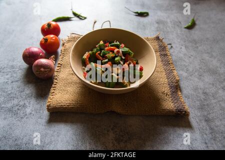 Indian vegetable preparation Okra or fried ladies finger in a bowl. Close up. Stock Photo