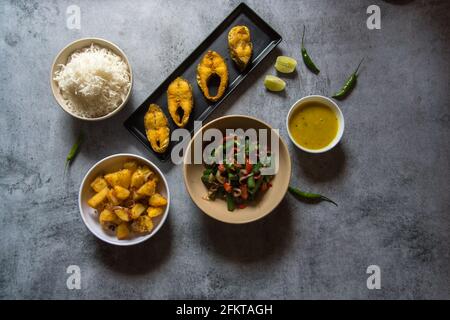 Indian lunch food ingredients rice fish vegetables and pulses with use of selective focus. A pure Bengali cuisine Stock Photo