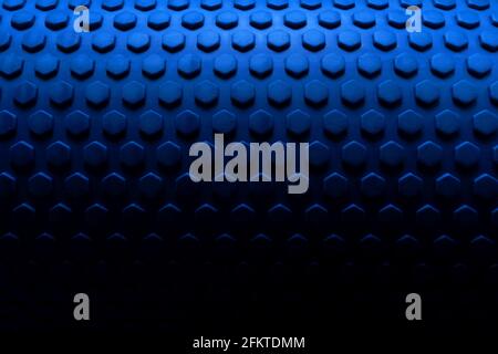 Texture in blue degraded to black color of a fitness foam roller for massage Stock Photo