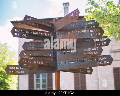 Road signs, signs indicating the distance from the main lakes in the world.Cernobbio, Como lake, Lombardy, Italy. Stock Photo
