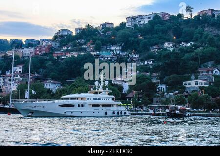 Istanbul, Turkey - May 12, 2013: View of Boats and Residential Houses on Bosphorus Waterfront Stock Photo
