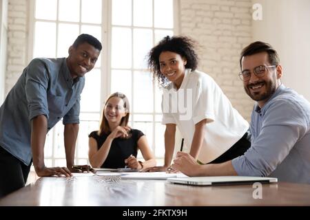 Group portrait of happy friendly motivated mixed race employees. Stock Photo