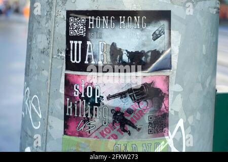 Sticker against violence against activists in Hong Kong Stock Photo