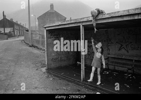 Children playing with a toy parachute, Blaencwm, near Treherbert, Rhondda Fawr, South Wales, 1973 Stock Photo