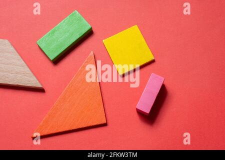 Concept of creative logical thinking. Different colorful wooden blocks. Geometric shapes in different colors. Stock Photo