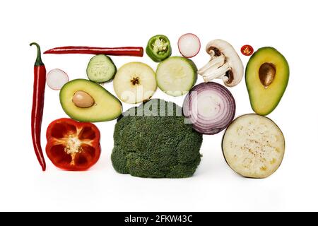 Sliced ??vegetables layout on a white background frontal view. Stock Photo