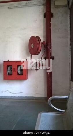 fire extinguisher pipe hose reel systems Stock Photo - Alamy