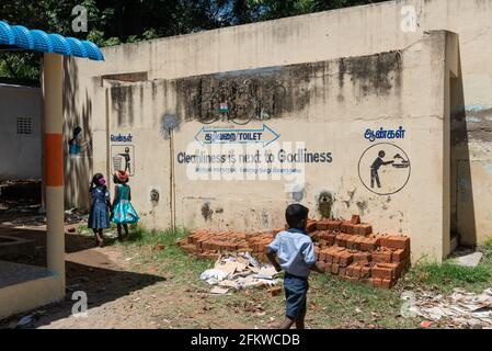 Tamil Nadu, India - March 2021: Hygiene precautions against Covid infection. Big mural near the toilets of a primary school. Stock Photo