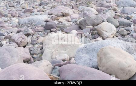 Texture of many sea pebbles stones and rocks colored in the background Stock Photo