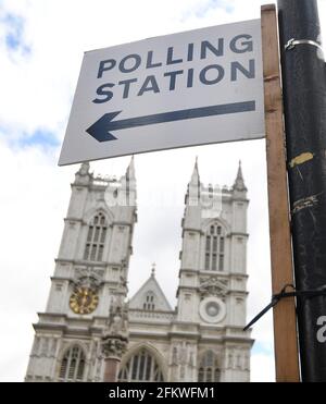 A direction sign is seen for a polling station ahead of local elections, near Westminster Abbey, London, Britain, May 4, 2021. REUTERS/Toby Melville