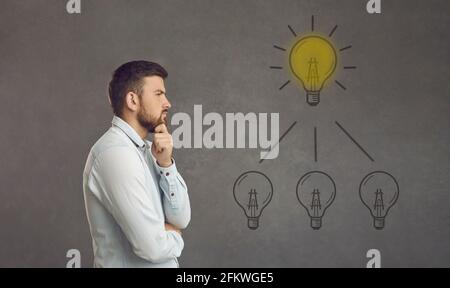 Thinking adult caucasian man try to find idea or problem solution profile photo Stock Photo
