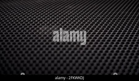 Black grille texture as a background. Stock Photo