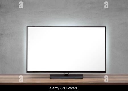 Tv set with blank screen on a wooden surface Stock Photo