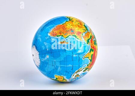 Round colorful school globe isolated on white background. Stock Photo