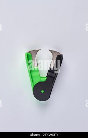 Top view of stapler remover isolated on white background. Stock Photo