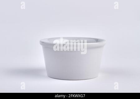 Small porcelain bowl isolated on white background. Stock Photo