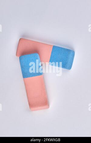 Close up of two colorful erasers isolated on white background. Stock Photo