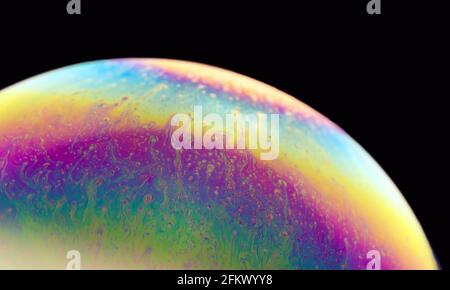 Colourful vibrant background. Psychedelic multicolored patterns background. Photo macro shot of Blurred soap bubbles Stock Photo