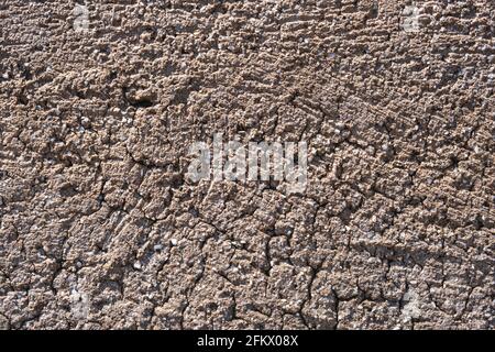 Beige empty old rough wall for background, texture. Exterior structure of stone, grunge concrete, porous, grainy mineral aged damaged vintage blank su Stock Photo