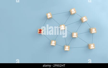 Leader connection for lines with people icon on Wooden cubes. Organization structure, team building, business management or human resources concepts. Stock Photo