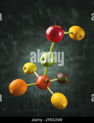 Connected fruits in the shape of molecular structure chain. Concept for vitamins diet or healthy natural food formula. Stock Photo