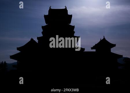 Matsumoto Castle, known as The Crow Castle silhouetted against the moonlight, Japan. Stock Photo