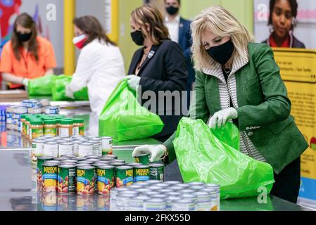 First Lady Jill Biden packs canned goods into bags for children in the Buddy Backpack program Friday, Feb. 26, 2021, at the Houston Food Bank in Houston. (Official White House Photo by Katie Ricks) Stock Photo