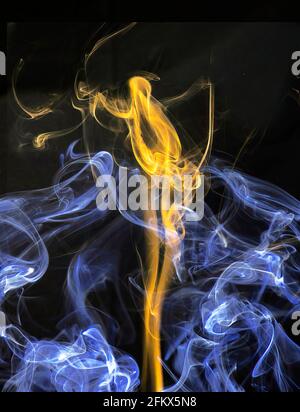Abstract colorful smoke against a black background Stock Photo