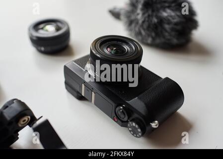 Photo camera on a white table. High quality photo. Stock Photo