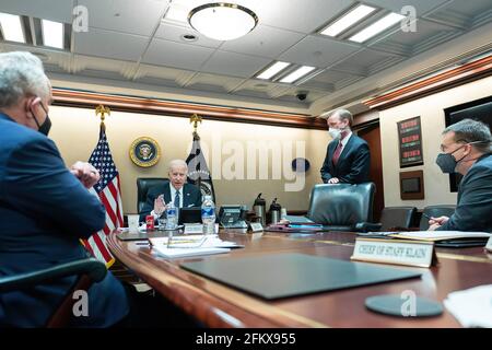 President Joe Biden, joined by White House staff, talks on the phone with Australian Prime Minister Scott Morrison Wednesday, Feb. 3, 2021, in the White House Situation Room. (Official White House Photo by Adam Schultz) Stock Photo