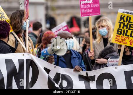 LONDON, UK - 01st May 2021: Kill the Bill, Black Lives Matter and Extinction Rebellion activists march in city with signs and banners. Crowded streets