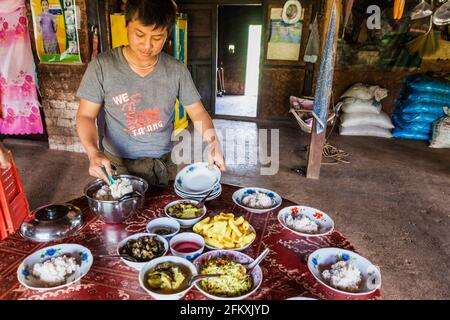 HSIPAW, MYANMAR - DECEMBER 1, 2016: Lunch in a homestay for the participants of a guided hike around Hsipaw, Myanmar Stock Photo