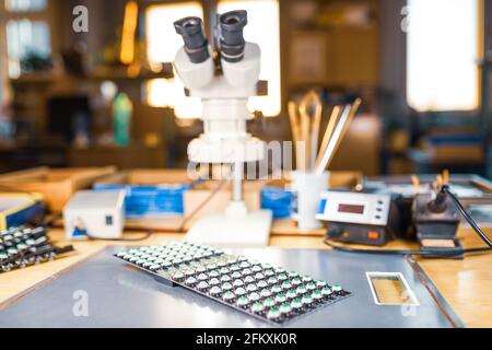 Modern microscope, Panel of LED light indicators is in the production Stock Photo