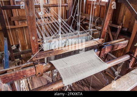 Wooden loom at a weaving workshop Inn Paw Khone village at Inle lake, Myanmar Stock Photo