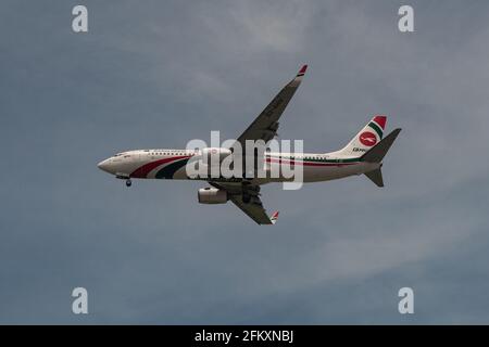 01.05.2021, Singapore, Republic of Singapore, Asia - Biman Bangladesh Airlines Boeing 737-800 passenger plane approaches Changi Airport for landing. Stock Photo