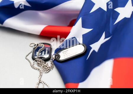 Soldier's token on American flag background Stock Photo