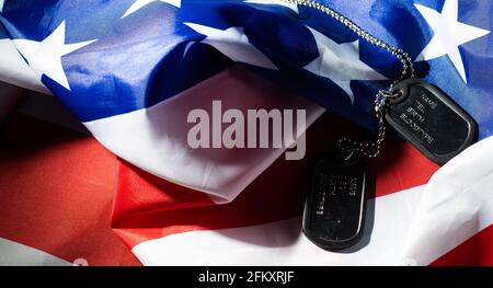 Soldier's token on American flag background Stock Photo