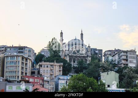 Istanbul, Turkey - May 12, 2013: Buildings and a Mosque on the Waterfront on a Sunny Day Stock Photo