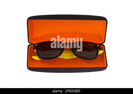 Pair of Dazzle sunglasses with yellow arms in sunglasses case with orange coloured lining isolated on white background Stock Photo