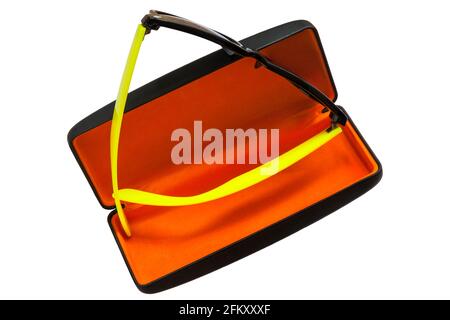 Pair of Dazzle sunglasses with yellow arms in sunglasses case with orange coloured lining isolated on white background Stock Photo