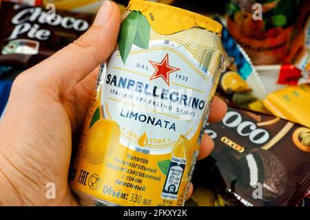 Tambov, Russian Federation - October 30, 2020 Sanpellegrino Limonata sparkling drinks can in woman hand. Stock Photo