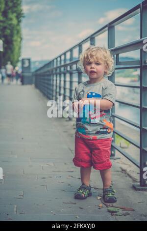 Young Blond hair boy stood alone Stock Photo