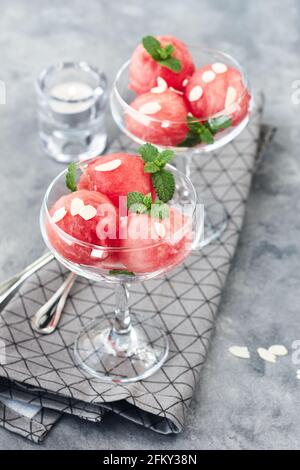 Watermelon balls with mint in a glass, summer refreshing dessert. Stock Photo