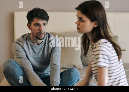 young couple in the bedroom communication conflict Stock Photo