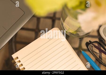 Personal diary background with blank notebook on the desktop, workspace and office desk concept, top view Stock Photo