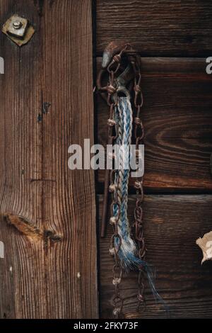 detail of an old wooden door with metal closing Stock Photo