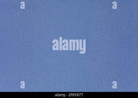 Blue wall, texture, background. The building wall, painted with water-based paint. Smooth (flat) surface in blue color Stock Photo